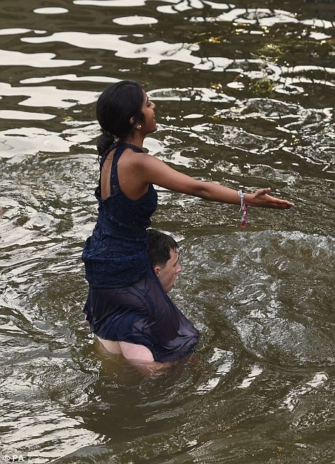 Some stripped down to their underwear while others wrecked their expensive outfits by soaking them in the river