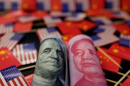 A U.S. dollar banknote featuring American founding father Benjamin Franklin and a China's yuan banknote featuring late Chinese chairman Mao Zedong are seen among U.S. and Chinese flags in this illustration picture taken May 20, 2019. Picture taken May 20, 2019. REUTERS/Jason Lee/Illustration A U.S. dollar banknote featuring American founding father Benjamin Franklin and a China's yuan banknote featuring late Chinese chairman Mao Zedong are seen among U.S. and Chinese flags in this illustration picture taken May 20, 2019. Picture taken May 20, 2019. REUTERS/Jason Lee/Illustration