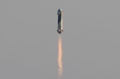 Billionaire businessman Jeff Bezos is launched with three crew members aboard a New Shepard rocket on the world's first unpiloted suborbital flight from Blue Origin's Launch Site 1 near Van Horn, Texas , U.S., July 20, 2021. REUTERS/Joe Skipper Billionaire businessman Jeff Bezos is launched with three crew members aboard a New Shepard rocket on the world's first unpiloted suborbital flight from Blue Origin's Launch Site 1 near Van Horn, Texas , U.S., July 20, 2021. REUTERS/Joe Skipper