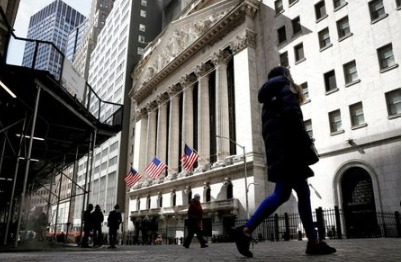 People are seen on Wall Street outside the New York Stock Exchange (NYSE) in New York City, U.S., March 19, 2021. REUTERS/Brendan McDermid People are seen on Wall Street outside the New York Stock Exchange (NYSE) in New York City, U.S., March 19, 2021. REUTERS/Brendan McDermid