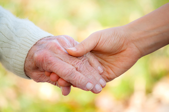 Senior and young holding hands 3043090