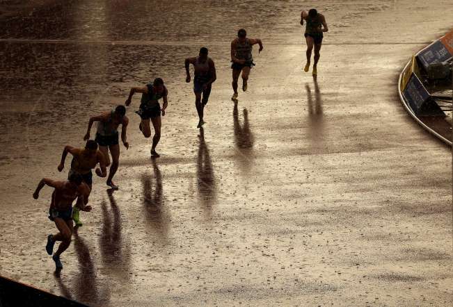 Athletes start during heavy rain in the heats of the Men's 800m event during the Sainsbury's British Athletics Championships on June 27, 2014.