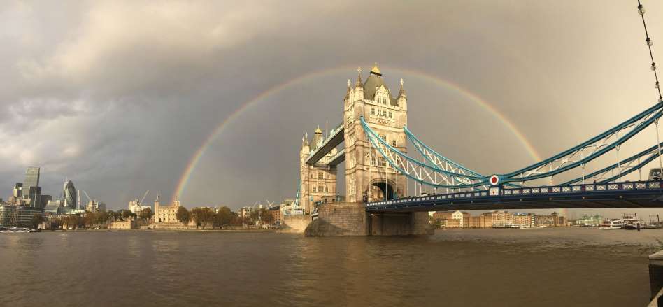 A view of a rainbow behind Tower Bridge on November 10, 2014.