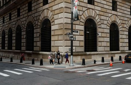 FILE PHOTO: People walk wearing masks outside The Federal Reserve Bank of New York in New York City, U.S., March 18, 2020. REUTERS/Lucas Jackson/File Photo/File Photo FILE PHOTO: People walk wearing masks outside The Federal Reserve Bank of New York in New York City, U.S., March 18, 2020. REUTERS/Lucas Jackson/File Photo/File Photo