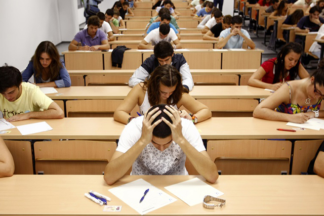 Students take a university entrance examination at a lecture hall in the Andalusian capital of Seville
