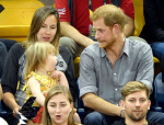 Prince Harry sits with David Henson's wife Hayley Henson and daugther Emily Henson at the Sitting Volleyball Finals Invictus Games, Toronto, Canada - 27 Sep 2017