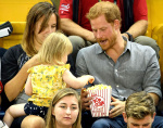 Prince Harry sits with David Henson's wife Hayley Henson and daugther Emily Henson at the Sitting Volleyball Finals Invictus Games, Toronto, Canada - 27 Sep 2017