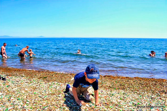 vodka-bottle-pebbles-glass-beach-ussuri-bay-russia-7