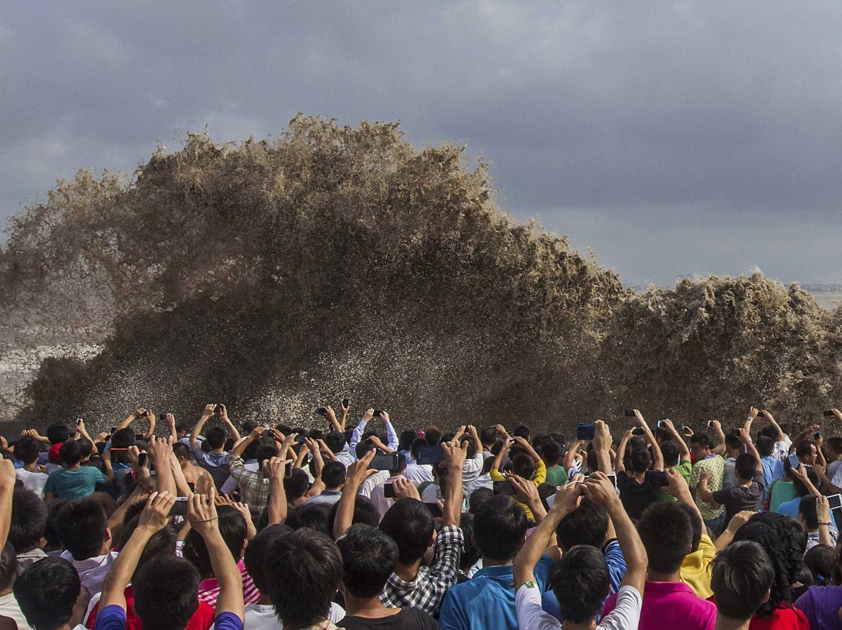 in-september-visitors-took-pictures-of-tidal-waves-created-by-a-severe-typhoon-in-hangzhou-in-the-zhejiang-province-of-china-the-storm-killed-two-people-in-the-philippines-and-injured-nine-people-in-taiwan
