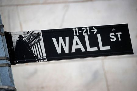 The Wall St. sign is seen outside The New York Stock Exchange (NYSE) in New York, U.S., March 1, 2021. REUTERS/Brendan McDermid The Wall St. sign is seen outside The New York Stock Exchange (NYSE) in New York, U.S., March 1, 2021. REUTERS/Brendan McDermid
