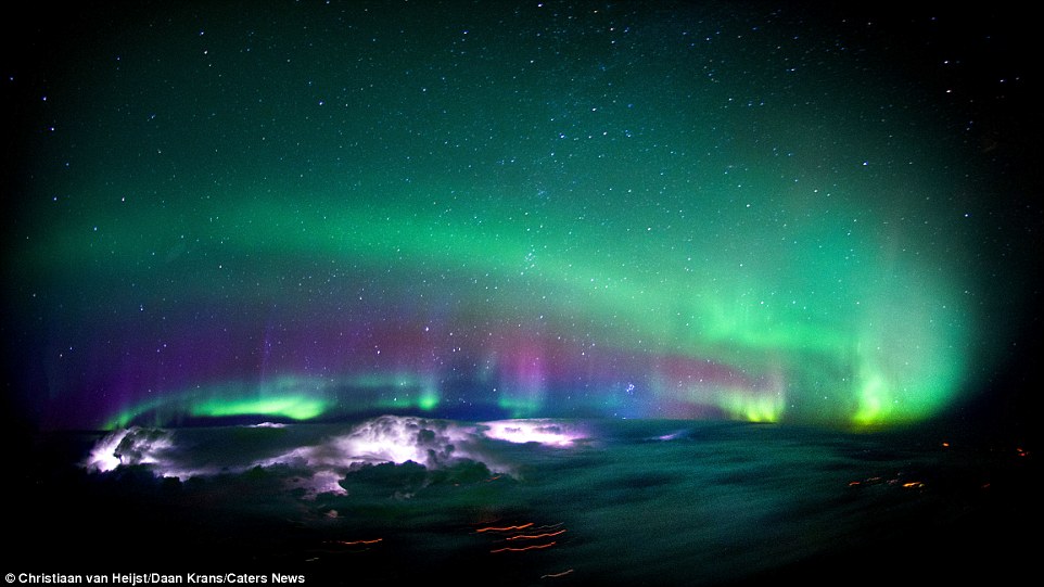 Van Heijst said of this amazing image: 'A beautiful show of Northern Lights over Canada, while a few active thunderstorms are illuminating the atmosphere from below. One of the most impressive things I have ever seen'