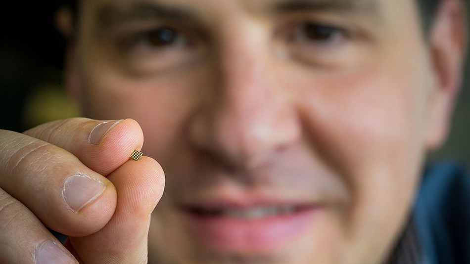 Microsoft Researcher Ofer Dekel holds a tiny microprocessor that might one day be able to run machine learning algorithms