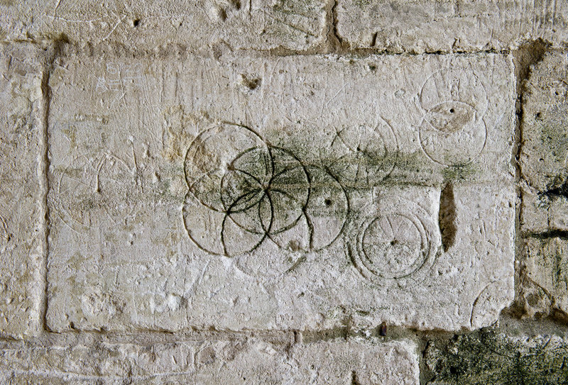 Daisy-Wheels inscribed with a pair of compasses or dividers found in Saxon Tithe barn, Bradford-on-Avon.
