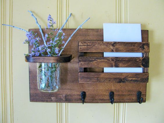 This mail organizer is perfect in rustic decor or country setting. Stained in dark walnut and includes pint jar and three key/robe hooks. Color may