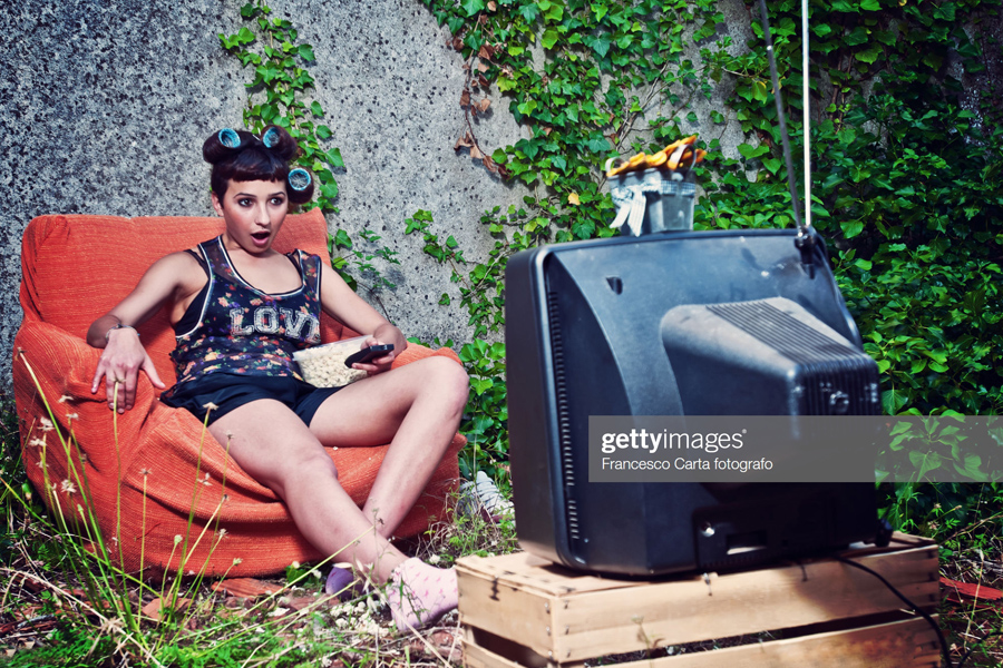 Young woman looking TV Young woman looking TV