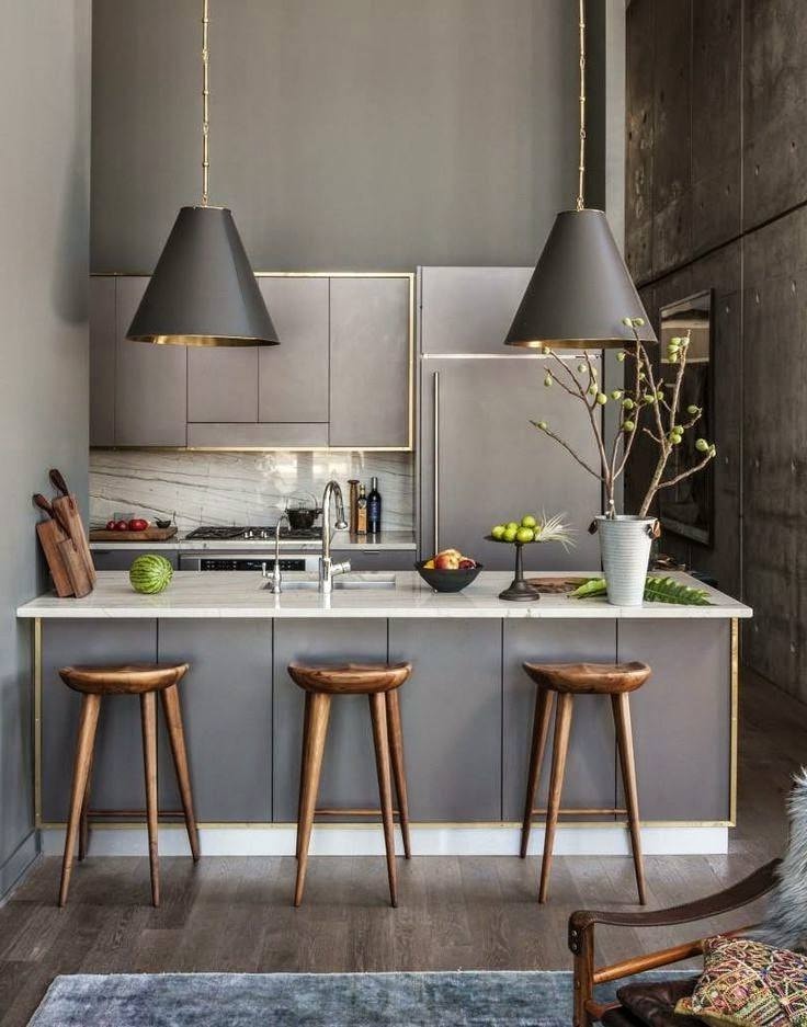Кухня серого цвета на фоне бетонных стен выглядит естественно и натурально