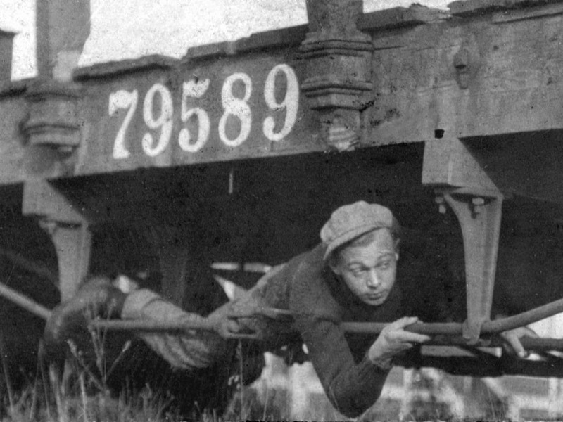 A hobo riding the rails, 1930s.