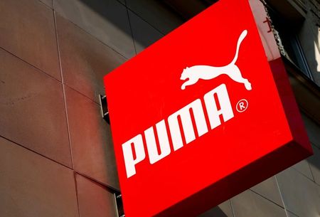 FILE PHOTO: The logo of German sports goods firm Puma is seen at the entrance of one of its stores in Vienna, Austria, March 18, 2016. REUTERS/Leonhard Foeger 