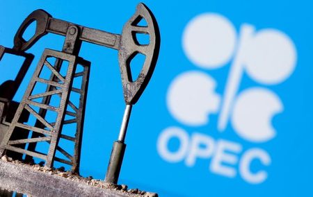 FILE PHOTO: A 3D-printed oil pump jack is seen in front of displayed OPEC logo in this illustration picture, April 14, 2020. REUTERS/Dado Ruvic