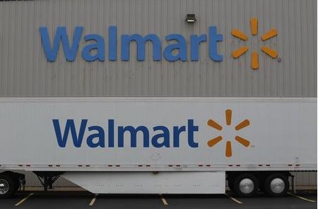 The Wal-Mart company logo is seen outside a Wal-Mart Stores Inc company distribution center in Bentonville, Arkansas June 6, 2013. REUTERS/Rick Wilking (UNITED STATES - Tags: BUSINESS)