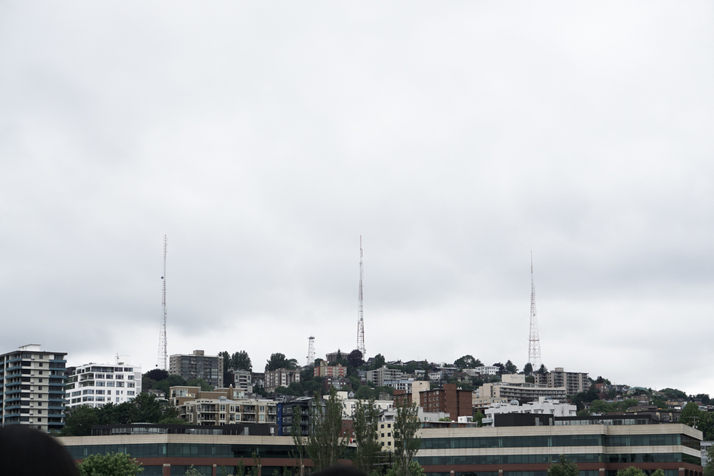  These three TV broadcast towers are in close proximity with  Queen Anne Hill , an affluent neighborhood just northwest of  Downtown Seattle , where the wealthy people live. 