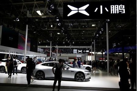 Cars are displayed at EV startup Xpeng's booth at the Beijing International Automotive Exhibition, or Auto China show, in Beijing, China September 27, 2020. REUTERS/Tingshu Wang