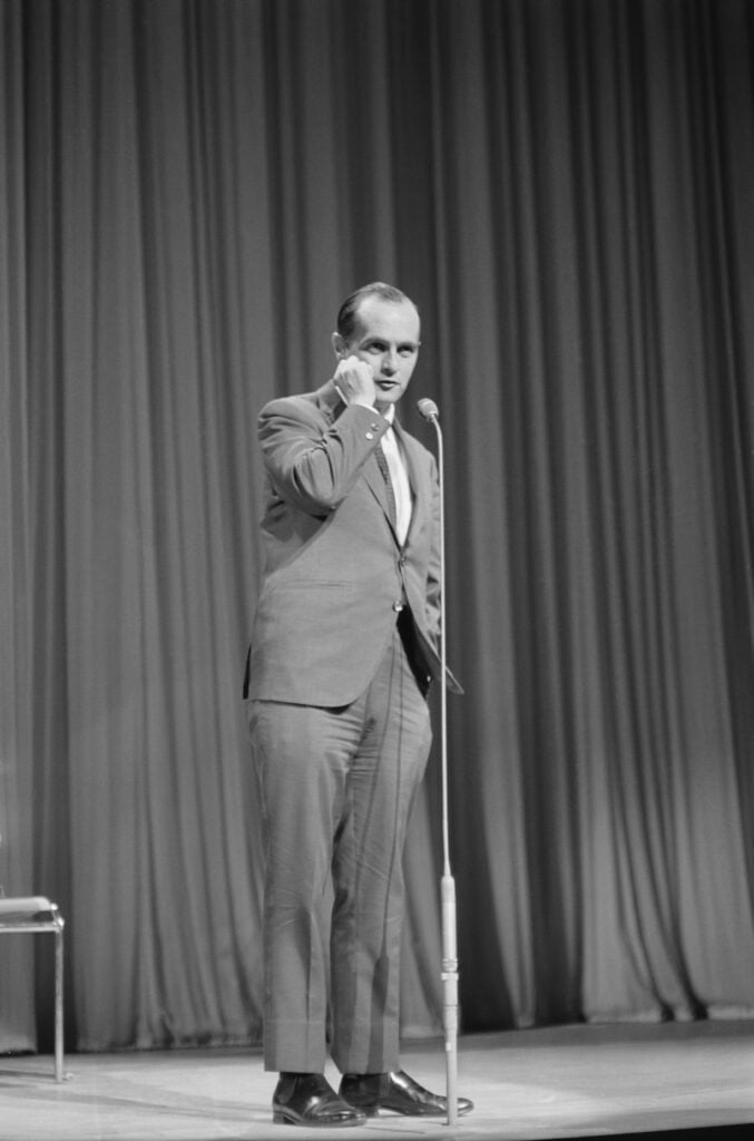 American comedian and actor Bob Newhart pictured on stage performing in the Royal Variety Performance at the Palladium in London on 2nd November 1964. (Photo by Daily Express/Hulton Archive/Getty Images)