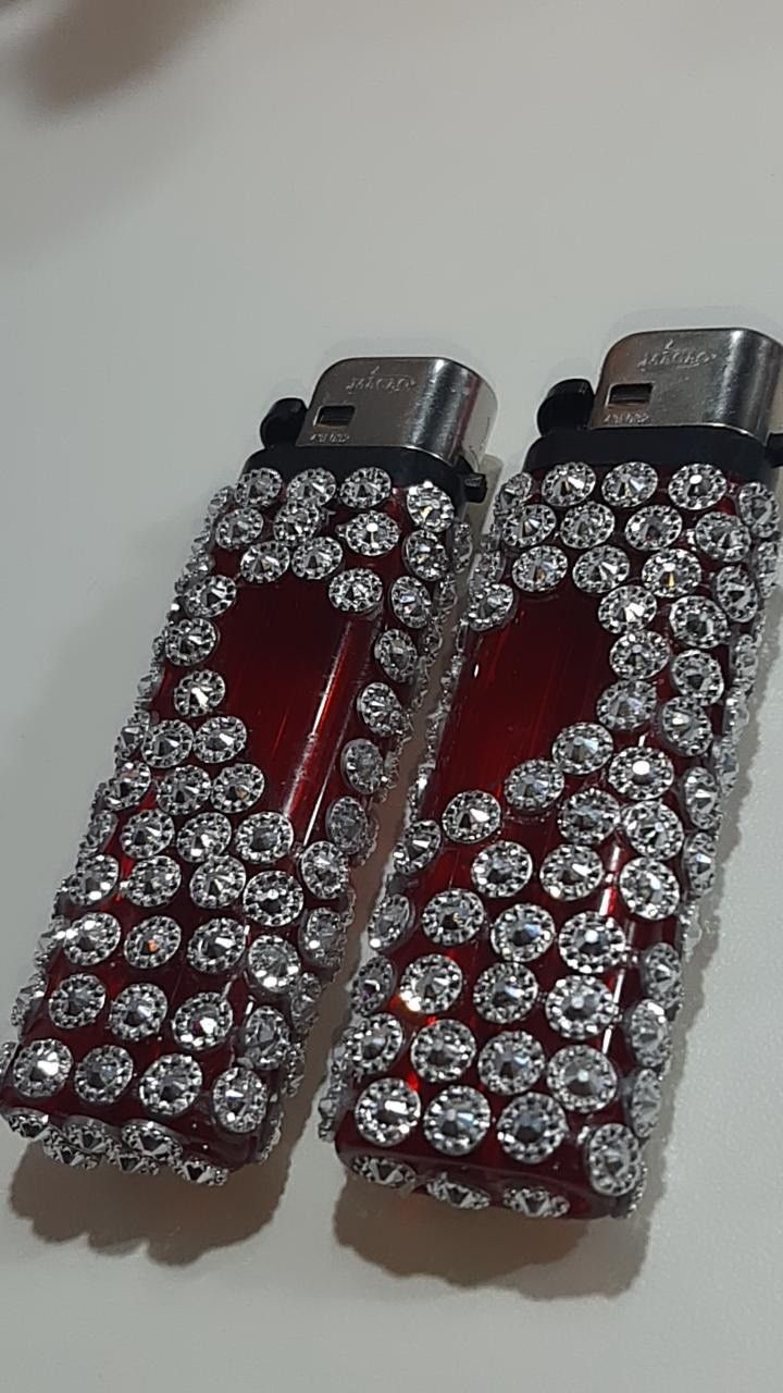 Two tumblr aesthetic red heart-studded Bic lighters