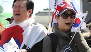 Реакция людей на решение КС Южной Кореи об импичменте Пак Кын Хе, Сеул. 10 марта 2017 год