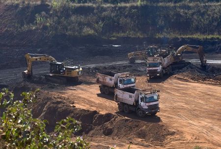 Unmanned vehicles remove iron ore mining waste to help shut down the Vale SA B3 and B4 dams due to the imminent risk of collapse at the Mar Azul mine in Nova Lima, Minas Gerais state, Brazil, July 23, 2021. REUTERS/Washington Alves 