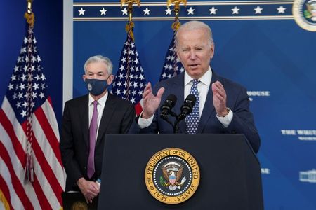 U.S. President Joe Biden announces the nomination of Federal Reserve Chair Jerome Powell for a second four-year term, and Federal Reserve board member Lael Brainard to serve as vice chair,as Powell stands byin the Eisenhower Executive Office Building's South Court Auditorium at the White House in Washington, U.S., November 22, 2021. REUTERS/Kevin Lamarque