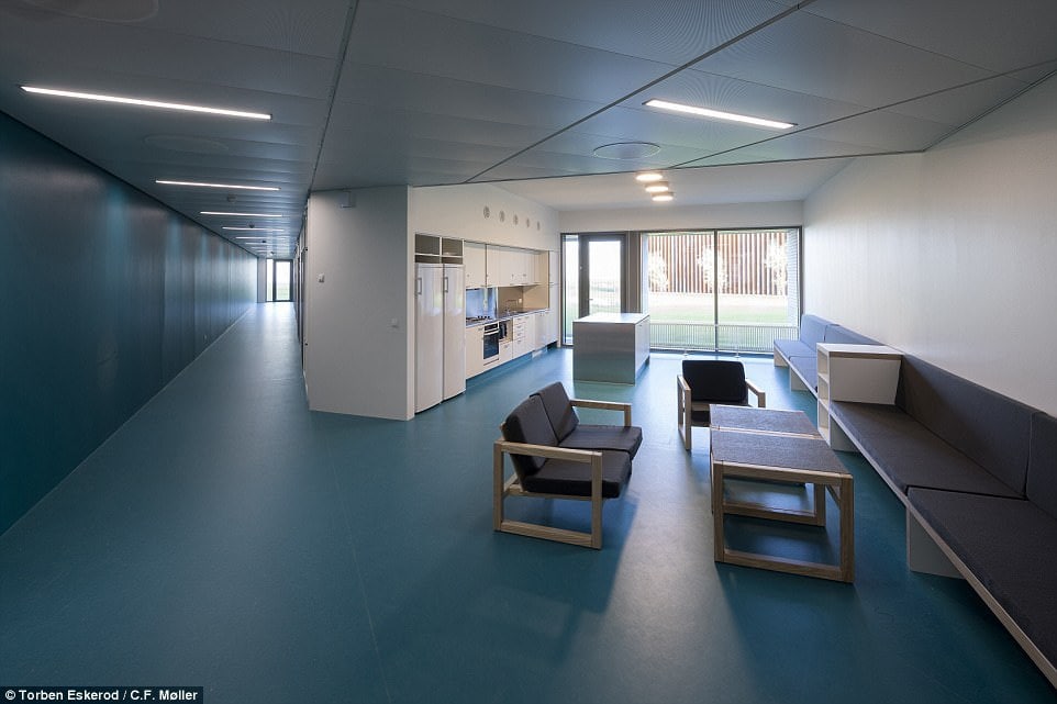 The intention of the designers is to give the prisoners - most of whom are locked up for violent crime - as much of a normal, free life as possible in a bid to accustom them to life on the outside. Pictured: One of the spacious common rooms 