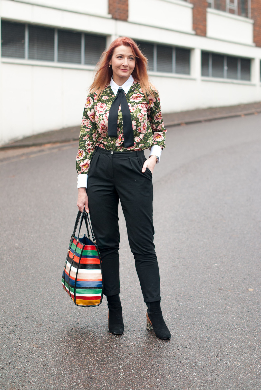 A masculine/feminine floral blouse with contrasting cuffs and black neck tie \ with black peg leg tapered trousers pants \ Finery two tone suede and leopard ankle boots \ multi-coloured striped Mango shopper bag | Not Dressed As Lamb, over 40 fashion