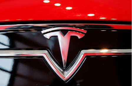 ILE PHOTO: A Tesla logo on a Model S is photographed inside of a Tesla dealership in New York, U.S., April 29, 2016. REUTERS/Lucas Jackson/File Photo