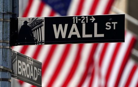 A Wall Street sign is pictured outside the New York Stock Exchange amid the coronavirus disease (COVID-19) pandemic in the Manhattan borough of New York City, New York, U.S., April 16, 2021. REUTERS/Carlo Allegri/File Photo
