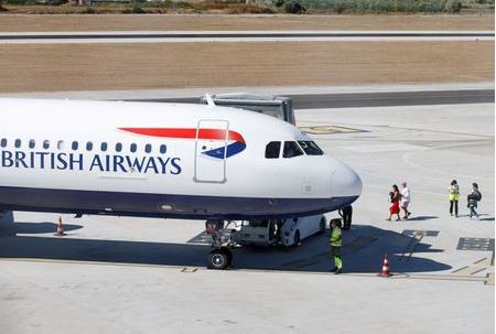 People board a British Airways airplane, as Croatia struggles with more cases of coronavirus disease (COVID-19), at the airport in Split, Croatia August 20, 2020. REUTERS/Antonio Bronic