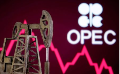 A 3D printed oil pump jack is seen in front of displayed stock graph and Opec logo in this illustration picture, April 14, 2020. REUTERS/Dado Ruvic/Illustration