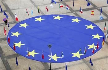 A large European Union flag lies at the centre of Schuman square, outside the European Commission headquarters, on the eve of Europe Day, commemorating the declaration made by Robert Schuman in 1950, in Brussels, Belgium, May 8, 2021. REUTERS/Yves Herman 