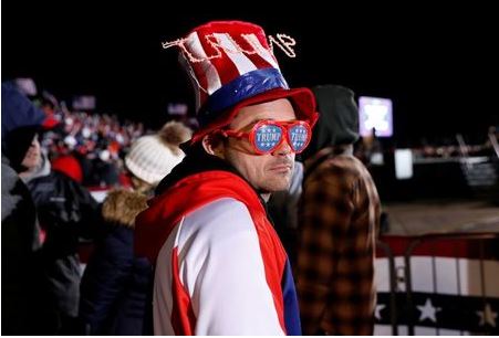 A supporter attends a campaign rally by U.S. President Donald Trump at Gerald R. Ford International Airport in Grand Rapids, Michigan, U.S., November 2, 2020. REUTERS/Shannon Stapleton