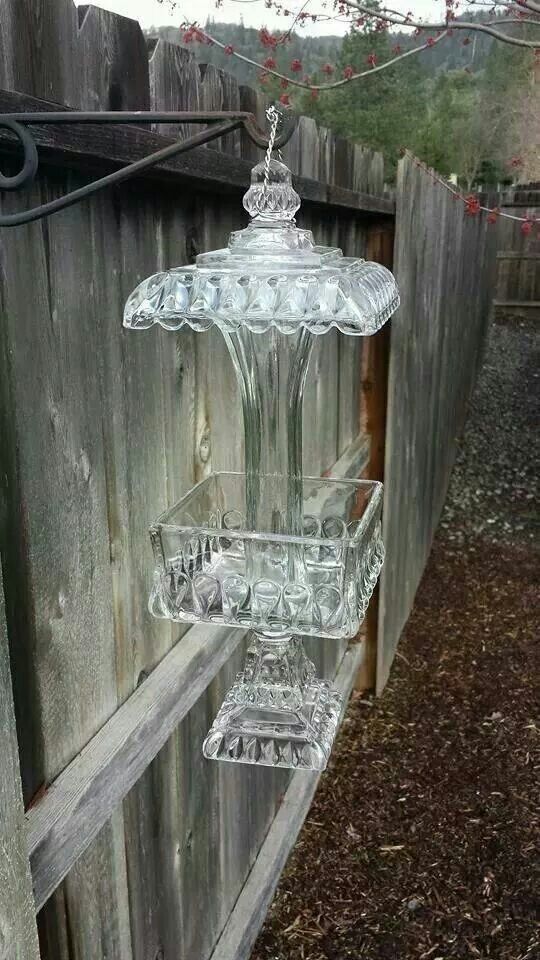 Old glass candy dishes repurposed as bird feeders