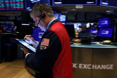Traders work on the floor of the New York Stock Exchange (NYSE) in New York City, U.S., August 27, 2021. REUTERS/Brendan McDermid 