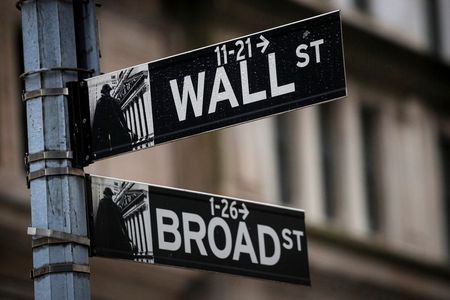 The Wall St. and Broad St. signs are seen outside The New York Stock Exchange (NYSE) in New York, U.S., February 16, 2021. REUTERS/Brendan McDermid