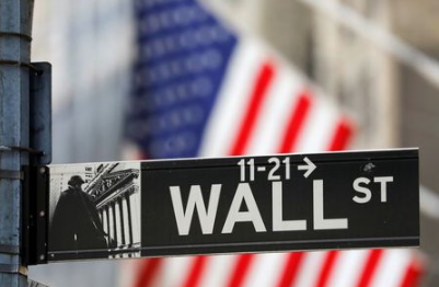 A street sign for Wall Street is seen outside the New York Stock Exchange (NYSE) in New York City, New York, U.S., July 19, 2021. REUTERS/Andrew Kelly
