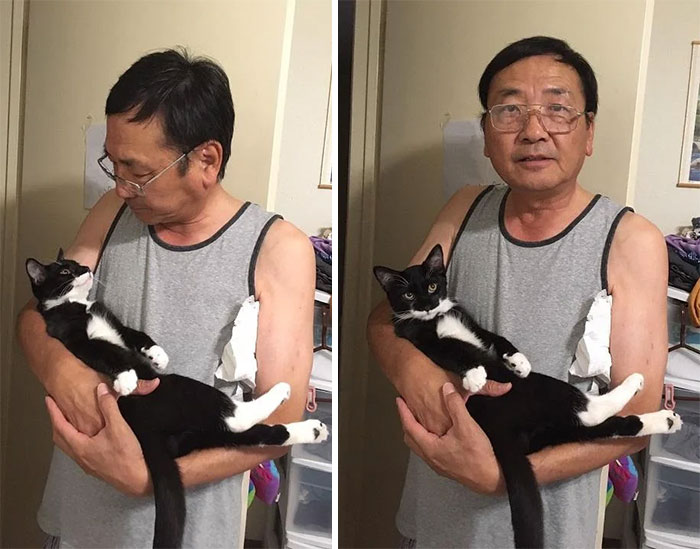 мужчина в очках с черно-белым котом на руках