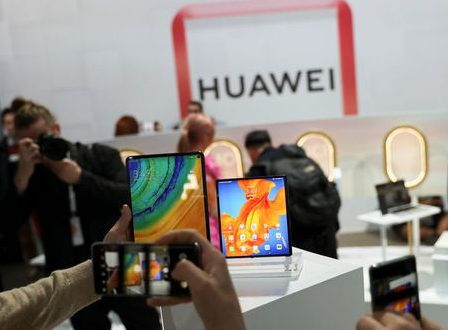 People take pictures of Huawei Mate Xs foldable smartphone and a Huawei MatePad Pro during Huawei product launch event in Barcelona, Spain February 24, 2020. REUTERS/Nacho Doce