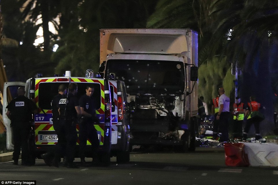 A truck ploughed through a large group of people in Nice during a suspected terrorist attack which claimed &quot;dozens of lives&quot; 