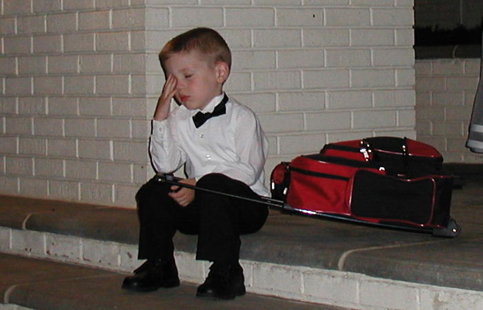 My Little Cousin After An All-Day Wedding Affair (The Suitcase Contains His Travel Toys)