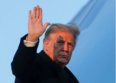 U.S. President Donald Trump waves as he boards Air Force One at Joint Base Andrews in Maryland, U.S., December 23, 2020. REUTERS/Tom Brenner TPX IMAGES OF THE DAY