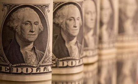 U.S. one dollar banknotes are seen in this illustration taken February 8, 2021. REUTERS/Dado Ruvic/Illustration