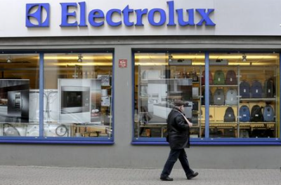 A man walks past an Electrolux shop in Riga, Latvia November 12, 2013. REUTERS/Ints Kalnins/File Photo